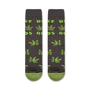 A gray sock with a green and red marijuana leaf pattern and the word 
