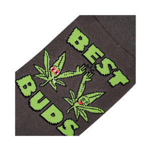 Close-up detail shot of the 'Best Buds' sock design, highlighting the cartoon marijuana leaves and text.