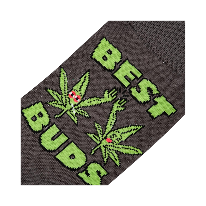 Close-up detail shot of the 'Best Buds' sock design, highlighting the cartoon marijuana leaves and text.