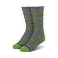 Pair of gray crew socks with green cannabis leaf pattern and 'Best Buds' text.  Features cartoon marijuana leaves with faces.