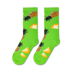 Flat lay showcasing a pair of lime green crew socks with a pineapple design.