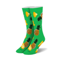 Pair of crew socks, lime green with yellow and orange pineapples and pineapple slices.