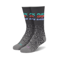 Pair of crew socks in dark gray with 'Fuck Off I'm Gaming' text in teal, pink, and red. Pixelated design fades down the sock.