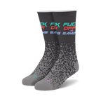 Pair of crew socks in dark gray with 'Fuck Off I'm Gaming' text in teal, pink, and red. Pixelated design fades down the sock.