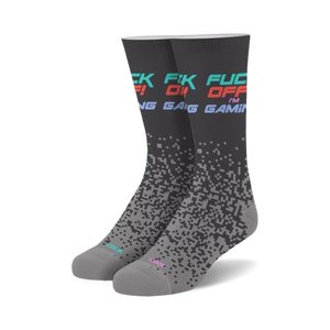 black and gray crew socks with colorful geometric pattern featuring the words 