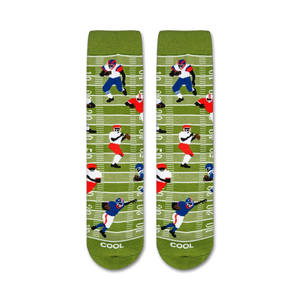 A pair of green socks with a football field pattern. The pattern includes two football players, one in blue and one in red.