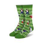 Crew socks in green, white, blue, and red. Design features cartoon football players on a field.