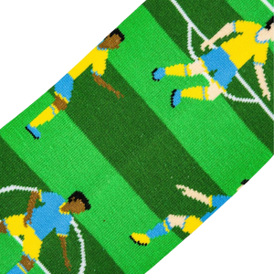 A green, white, and yellow striped background fabric with a pattern of blue and yellow cartoon soccer players.