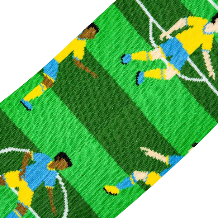 A green, white, and yellow striped background fabric with a pattern of blue and yellow cartoon soccer players.
