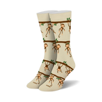 Pair of beige crew socks with a repeating pattern of brown monkeys hanging from tree branches. Green leaves are also included in the design.