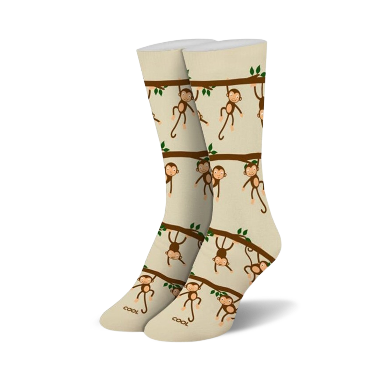 Pair of beige crew socks with a repeating pattern of brown monkeys hanging from tree branches. Green leaves are also included in the design.