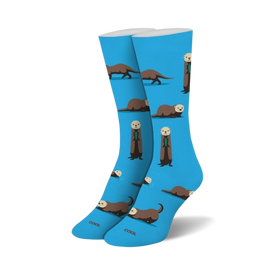 womens blue crew socks with brown and black cartoon sea otters. some of the sea otters hold fish.    