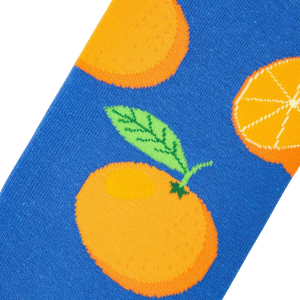 A blue background with a pattern of cartoon oranges.