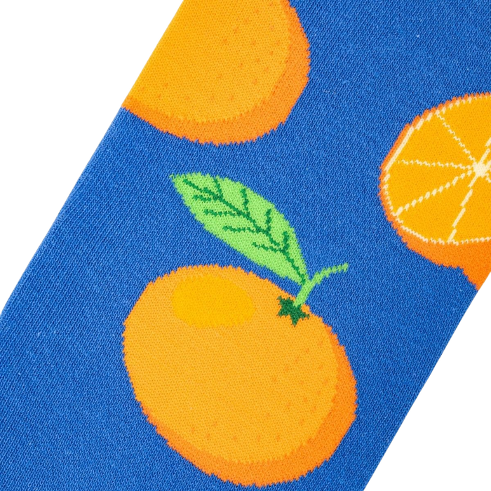 A blue background with a pattern of cartoon oranges.