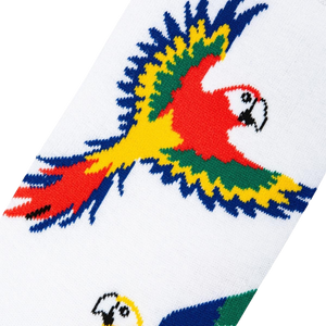 A white sock with a pattern of red, green, yellow, and blue parrots.