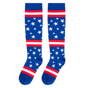 Flat front-facing view of two knee-high socks featuring a blue base, white stars, and red and white horizontal bands.