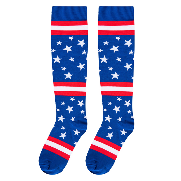 Flat front-facing view of two knee-high socks featuring a blue base, white stars, and red and white horizontal bands.