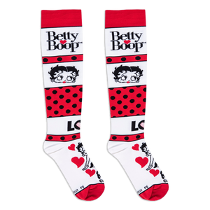 Flat lay view of Betty Boop socks focusing on the upper section with her trademarked logo and cute classic face.