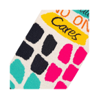 Close-up detail shot showing the colorful block pattern and text on the socks.