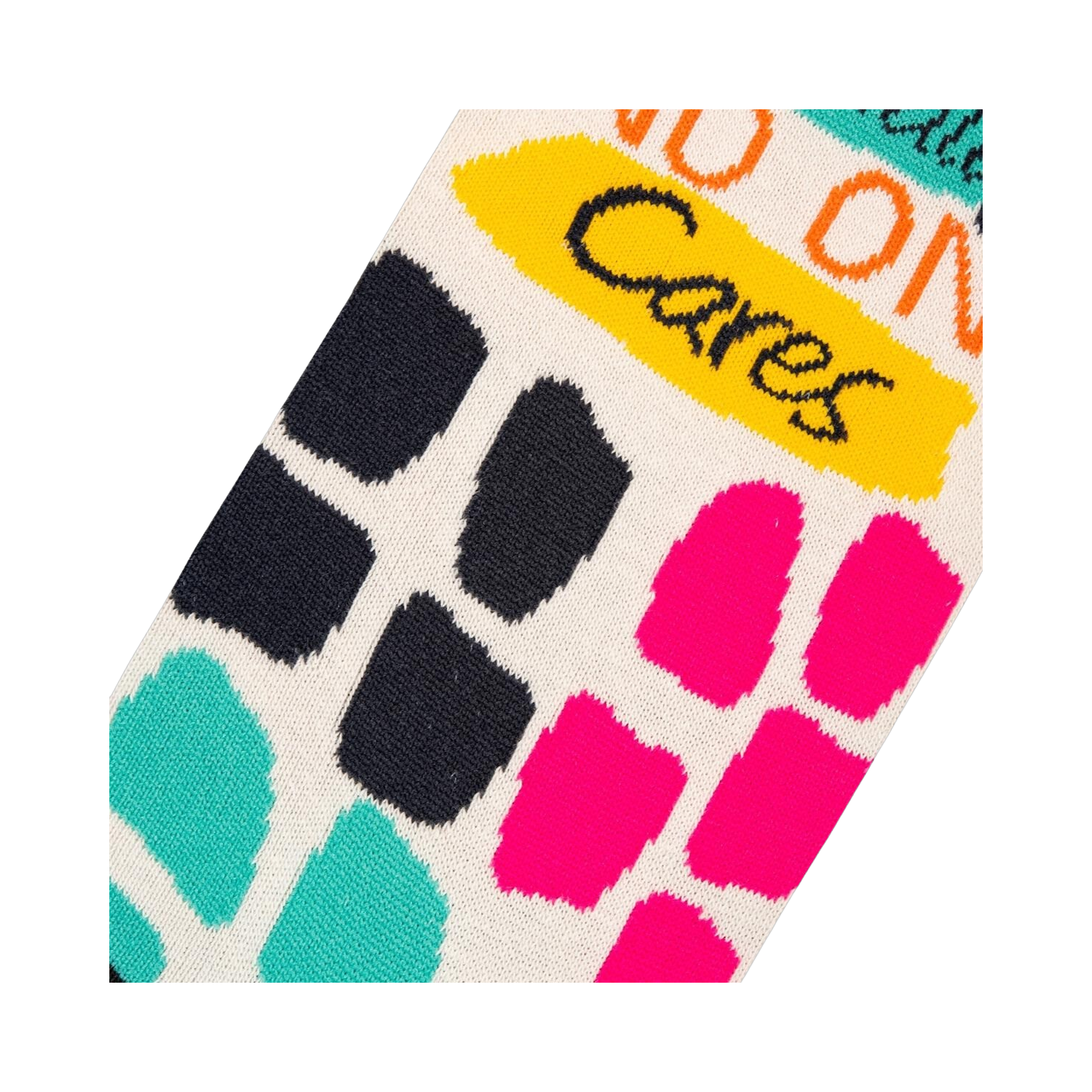 Close-up detail shot showing the colorful block pattern and text on the socks.