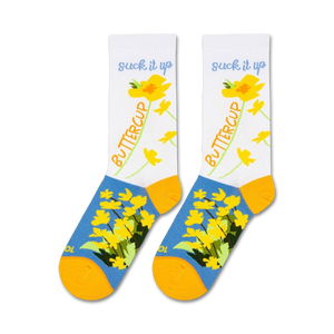 A pair of white socks with a blue toe, heel, and cuff. The socks have a floral pattern of yellow buttercups and green leaves. The words 