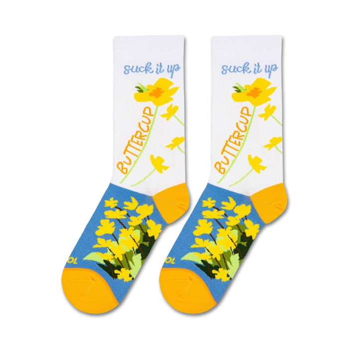 A pair of white socks with a blue toe, heel, and cuff. The socks have a floral pattern of yellow buttercups and green leaves. The words 
