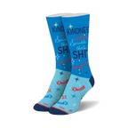 Crew socks in light blue with navy and red accents.  The design includes the phrase 'Kindness is free. Sprinkle that SHIT everywhere!' and shooting stars.