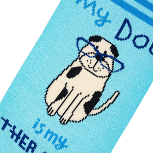 A blue sock with a cartoon dog wearing glasses on it. The dog is sitting and has a paw raised. The words 