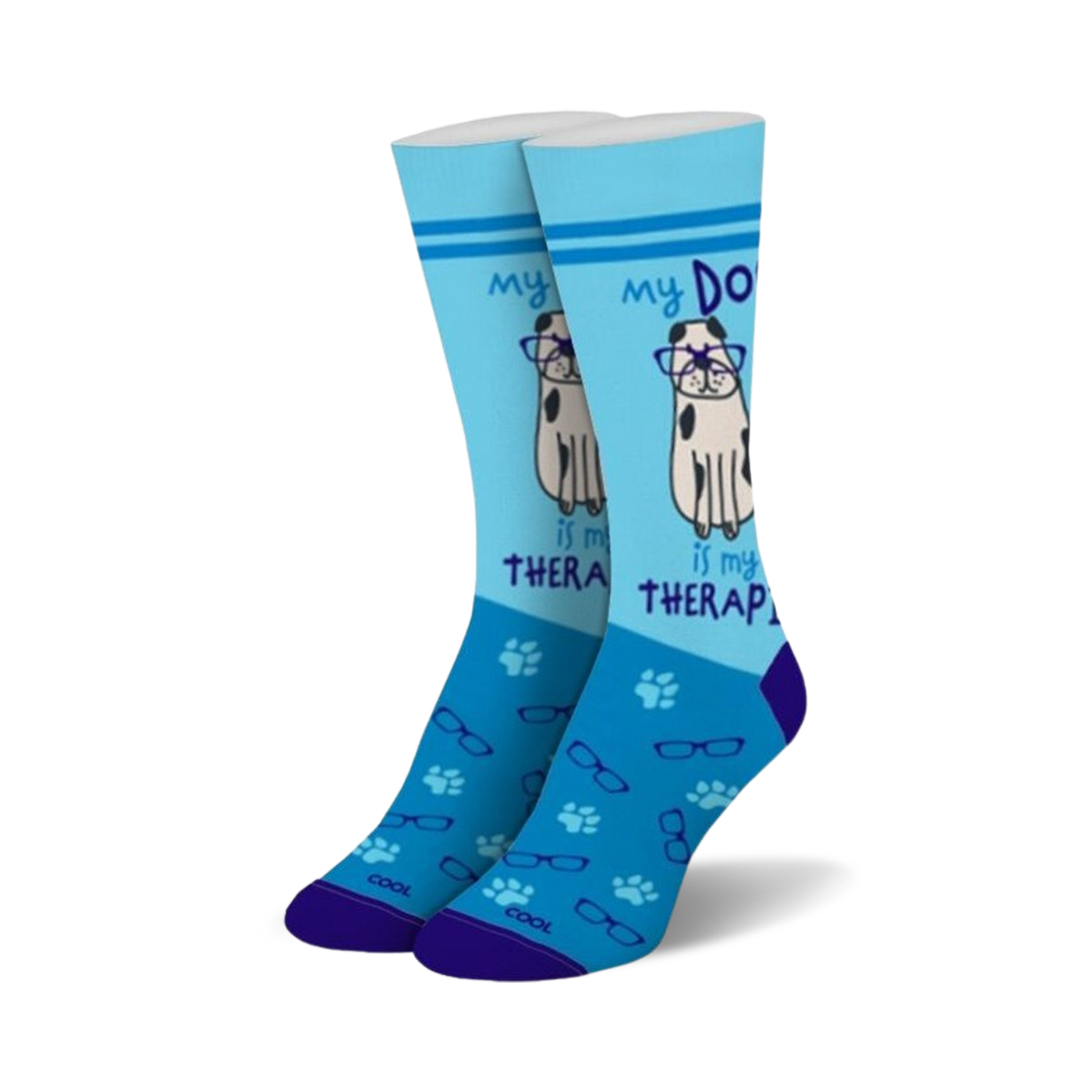 Pair of light blue crew socks with a cute dog wearing glasses graphic and the text 'My Dog Is My Therapist'.  Features paw prints and glasses icons.
