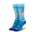 Pair of light blue crew socks with a cute dog wearing glasses graphic and the text 'My Dog Is My Therapist'.  Features paw prints and glasses icons.