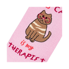 Close-up detail shot of the cat illustration and text on the sock.