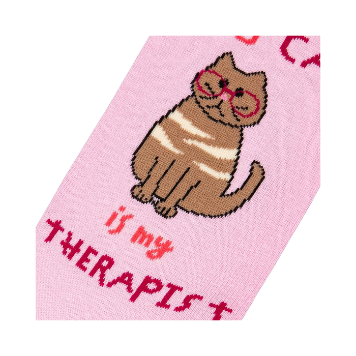 Close-up detail shot of the cat illustration and text on the sock.