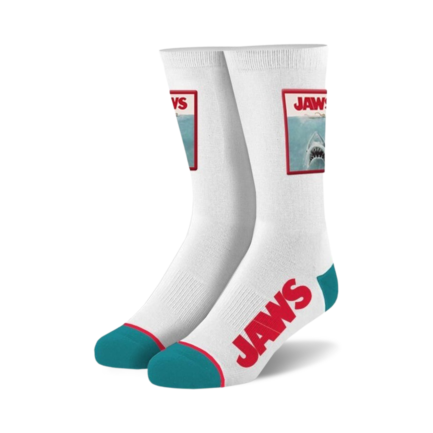 Pair of white crew socks.  Feature a Jaws movie poster image and red 'JAWS' text. Teal accents at the heel and toe.