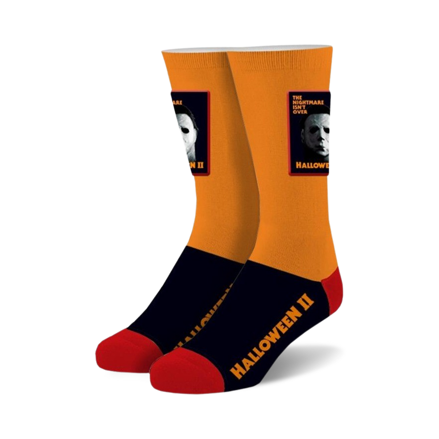 Pair of Halloween II crew socks. Orange and black with red accents, featuring Michael Myers' image and movie title.