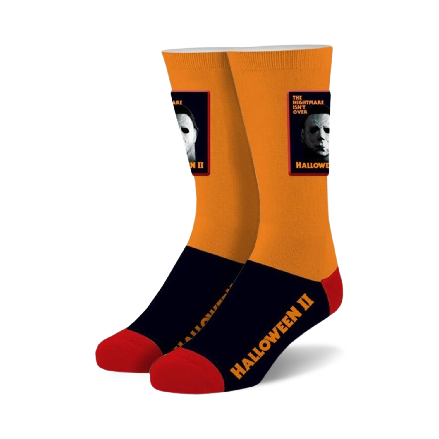 Pair of Halloween II crew socks. Orange and black with red accents, featuring Michael Myers' image and movie title.