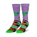 Pair of crew socks. Lavender background with repeating TMNT face pattern and orange, green, and black camouflage print on the lower part. 