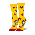 Pair of women's crew socks, yellow with red stars, Betty Boop images, and 'Ooh La La' text.