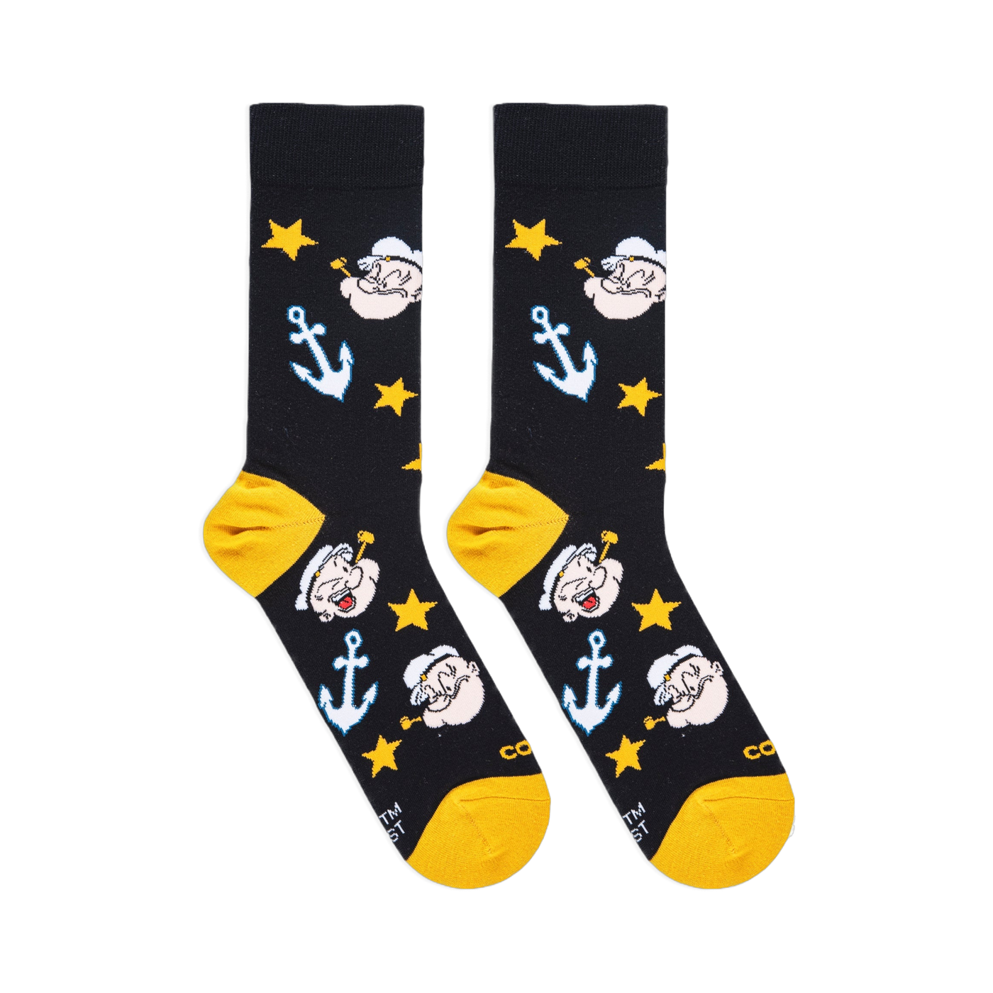 Flat lay of black socks showing Popeye's face with a pipe, light blue anchors, yellow stars, and yellow heels and toes.