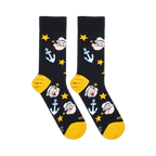Flat lay of black socks showing Popeye's face with a pipe, light blue anchors, yellow stars, and yellow heels and toes.