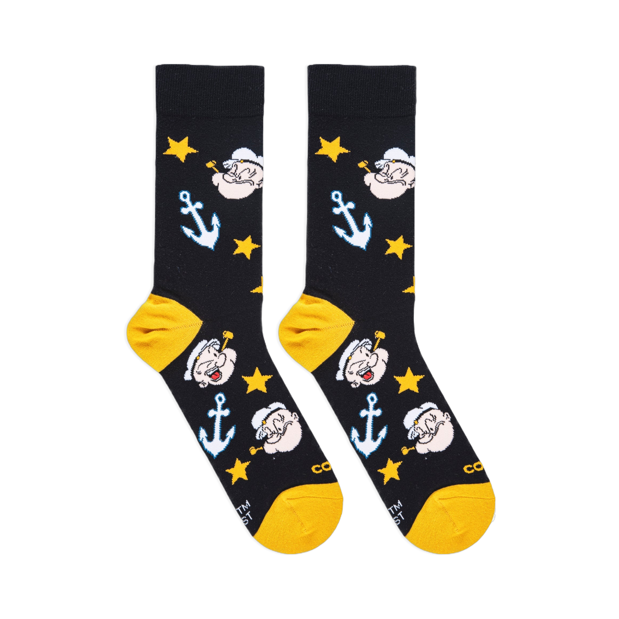 Flat lay of black socks showing Popeye's face with a pipe, light blue anchors, yellow stars, and yellow heels and toes.