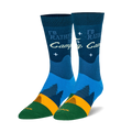 Pair of crew socks, navy blue, teal, and orange. Design includes a campfire scene, pine trees, and the text 'I'd Rather Be Camping'.