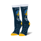 Pair of women's crew socks. Dark blue with white text reading 'Don't be a Salty Bitch', yellow girl illustration under an umbrella, and white polka dots. Yellow cuffs.