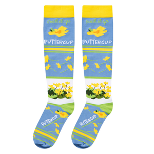 Full flat lay of blue floral socks highlighting the yellow cuffs and buttercup pattern with the word COOL on the toe.