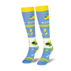 Angled view of knee-high socks displaying a white band filled with yellow buttercups and green leaves.