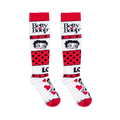 Flat lay of white and red knee-high socks showing the Betty Boop logo, her face, polka dots, and a love graphic.