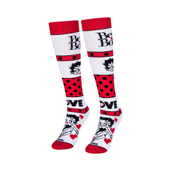 White knee-high socks featuring Betty Boop text, her face, bold red polka dot stripes, and the word LOVE with red hearts.