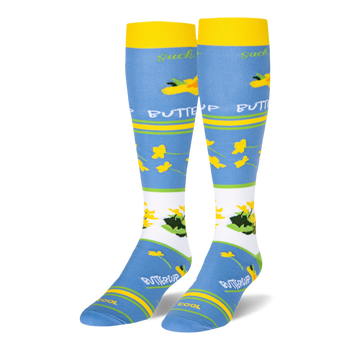 Light blue knee-high socks featuring yellow cuffs and buttercup patterns alongside text reading suck it up BUTTERCUP.