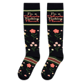 Flat lay view of black knee-high socks showing the full floral pattern and the I'm a Delicate Fucking Flower text.