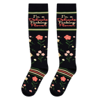 Flat lay view of black knee-high socks showing the full floral pattern and the I'm a Delicate Fucking Flower text.