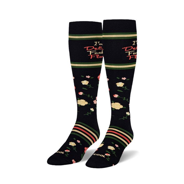 Black knee-high socks with pink and yellow roses, green stripes, and text reading I'm a Delicate Fucking Flower.